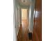 Hallway with hardwood floors leads to other rooms at 1030 N Concord N St, Indianapolis, IN 46222