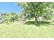 Lush backyard with healthy green grass and mature trees, perfect for outdoor activities at 10760 Independence Way, Carmel, IN 46032