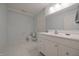 Simple bathroom showcasing a vanity sink and ceramic tile flooring at 10760 Independence Way, Carmel, IN 46032