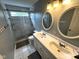 This bathroom has double sinks, a walk-in shower, and granite countertops at 10760 Independence Way, Carmel, IN 46032