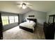 Spacious bedroom features vaulted ceilings, a ceiling fan, and a triple window at 10760 Independence Way, Carmel, IN 46032
