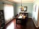 This charming dining room features a wood table, decor, and a delightful chandelier at 10760 Independence Way, Carmel, IN 46032