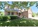 Beautiful home with a inviting front porch, manicured lawn, and attached two-car garage at 10760 Independence Way, Carmel, IN 46032