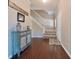 Inviting foyer with hardwood floors, staircase, and stylish decor at 10760 Independence Way, Carmel, IN 46032