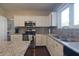 Bright kitchen with stainless steel appliances, granite counters, and ample counter space at 10760 Independence Way, Carmel, IN 46032
