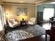 Cozy living room with hardwood floors, stylish seating, and lots of natural light at 10760 Independence Way, Carmel, IN 46032