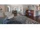 Cozy living room featuring stylish decor and hardwood floors that lead into the dining area at 10760 Independence Way, Carmel, IN 46032