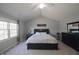 Bright main bedroom with vaulted ceilings, ceiling fan, and large window offering natural light at 10760 Independence Way, Carmel, IN 46032