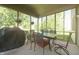 Cozy screened porch includes outdoor seating, creating a pleasant area for relaxation at 10760 Independence Way, Carmel, IN 46032