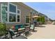 Backyard patio area with comfortable seating, a hot tub, and lush landscaping at 1102 Clearwell Dr, Greenwood, IN 46143