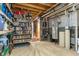 Basement utility area with shelving, water heater, and exposed pipes at 1102 Clearwell Dr, Greenwood, IN 46143