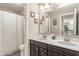 Bathroom with double vanity sinks, framed mirrors, and a shower-tub combination at 1102 Clearwell Dr, Greenwood, IN 46143