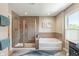Bright bathroom featuring a glass-enclosed shower and a soaking tub at 1102 Clearwell Dr, Greenwood, IN 46143
