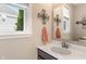 Modern half bathroom with a sleek vanity, stylish mirror, and natural light at 1102 Clearwell Dr, Greenwood, IN 46143