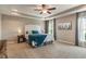 Bright bedroom with a ceiling fan, neutral walls, and plush carpet at 1102 Clearwell Dr, Greenwood, IN 46143