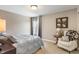Bedroom with a bed, accent chair, and a cozy atmosphere at 1102 Clearwell Dr, Greenwood, IN 46143