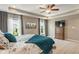 Bedroom with a large bed, soft carpet, and a wooden dresser at 1102 Clearwell Dr, Greenwood, IN 46143