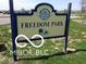 Community sign for Freedom Park with landscaping at 1102 Clearwell Dr, Greenwood, IN 46143
