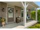 Inviting front porch with cozy bench and brick facade at 1102 Clearwell Dr, Greenwood, IN 46143