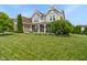 Charming two-story home boasting manicured lawn and lush landscape at 1102 Clearwell Dr, Greenwood, IN 46143