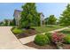 Beautifully landscaped front yard with lush plants, bushes, and trees at 1102 Clearwell Dr, Greenwood, IN 46143