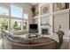 Spacious living room with a fireplace, large windows, and ample natural light at 1102 Clearwell Dr, Greenwood, IN 46143