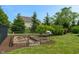 A lovely fenced vegetable garden with raised garden beds, ideal for growing fresh produce at 1102 Clearwell Dr, Greenwood, IN 46143