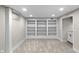Finished basement space with built-in shelving at 11035 W Lakeshore Dr, Carmel, IN 46033