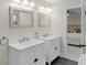 Bright bathroom featuring double vanity sinks and neutral decor at 11035 W Lakeshore Dr, Carmel, IN 46033