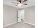 Bedroom with ceiling fan, carpet, and white door leading to additional room at 11035 W Lakeshore Dr, Carmel, IN 46033