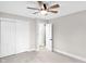Neutral bedroom with carpet and door with double sliding door closet to hall at 11035 W Lakeshore Dr, Carmel, IN 46033