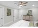 Comfortable bedroom featuring a ceiling fan, stylish artwork, and neutral decor at 11035 W Lakeshore Dr, Carmel, IN 46033
