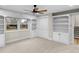 Bedroom with lots of storage with built-in bookcases, cabinets, closet and ceiling fan at 11035 W Lakeshore Dr, Carmel, IN 46033