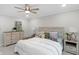 Bright bedroom featuring a ceiling fan, neutral color palette, and stylish furnishings at 11035 W Lakeshore Dr, Carmel, IN 46033