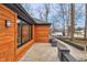 Modern home exterior with wood siding, dark trim, and a well-maintained walkway at 11035 W Lakeshore Dr, Carmel, IN 46033