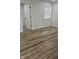 Bright bedroom features new flooring and a window for natural light at 1125 S Drexel Ave, Indianapolis, IN 46203