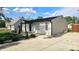Renovated single story home boasting a modern design, landscaping, and a newly poured concrete driveway at 1125 S Drexel Ave, Indianapolis, IN 46203
