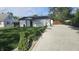 Home with green lawn and concrete driveway at 1125 S Drexel Ave, Indianapolis, IN 46203