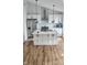 Bright kitchen features an island, stainless steel appliances, and stylish pendant lights at 1125 S Drexel Ave, Indianapolis, IN 46203