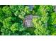 Aerial view of backyard featuring cozy seating and mature tree coverage for privacy and shade at 11510 Ralston Ave, Carmel, IN 46032