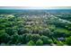 Expansive aerial perspective captures a residential area bordering a large green space with mature trees at 11510 Ralston Ave, Carmel, IN 46032