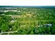 A neighborhood filled with mature trees and greenery with homes nestled among them at 11510 Ralston Ave, Carmel, IN 46032