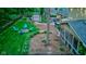 Large backyard featuring a shed, a fire pit with Adirondack chairs, a hot tub, and a screened-in porch at 11510 Ralston Ave, Carmel, IN 46032