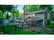 Expansive backyard featuring a shed, lush greenery, a hot tub, outdoor seating, and a charming screened-in porch at 11510 Ralston Ave, Carmel, IN 46032