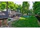 An outdoor haven with a fire pit and fenced yard offers relaxation and entertainment at 11510 Ralston Ave, Carmel, IN 46032