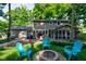 Backyard featuring a fire pit, Adirondack chairs, and a screened-in porch for relaxing and entertaining at 11510 Ralston Ave, Carmel, IN 46032