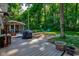 Backyard featuring outdoor seating, grill, a fire pit, and a screened-in porch for outdoor enjoyment at 11510 Ralston Ave, Carmel, IN 46032