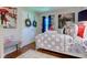 Charming bedroom with hardwood floors, a comfortable bed, and artistic decor creating a cozy ambiance at 11510 Ralston Ave, Carmel, IN 46032