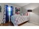 Serene bedroom with a patterned bedspread, ample natural light, and stylish decor creating a peaceful retreat at 11510 Ralston Ave, Carmel, IN 46032