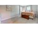 This bedroom features wall trim, carpet, two windows, and wood chest at 11510 Ralston Ave, Carmel, IN 46032